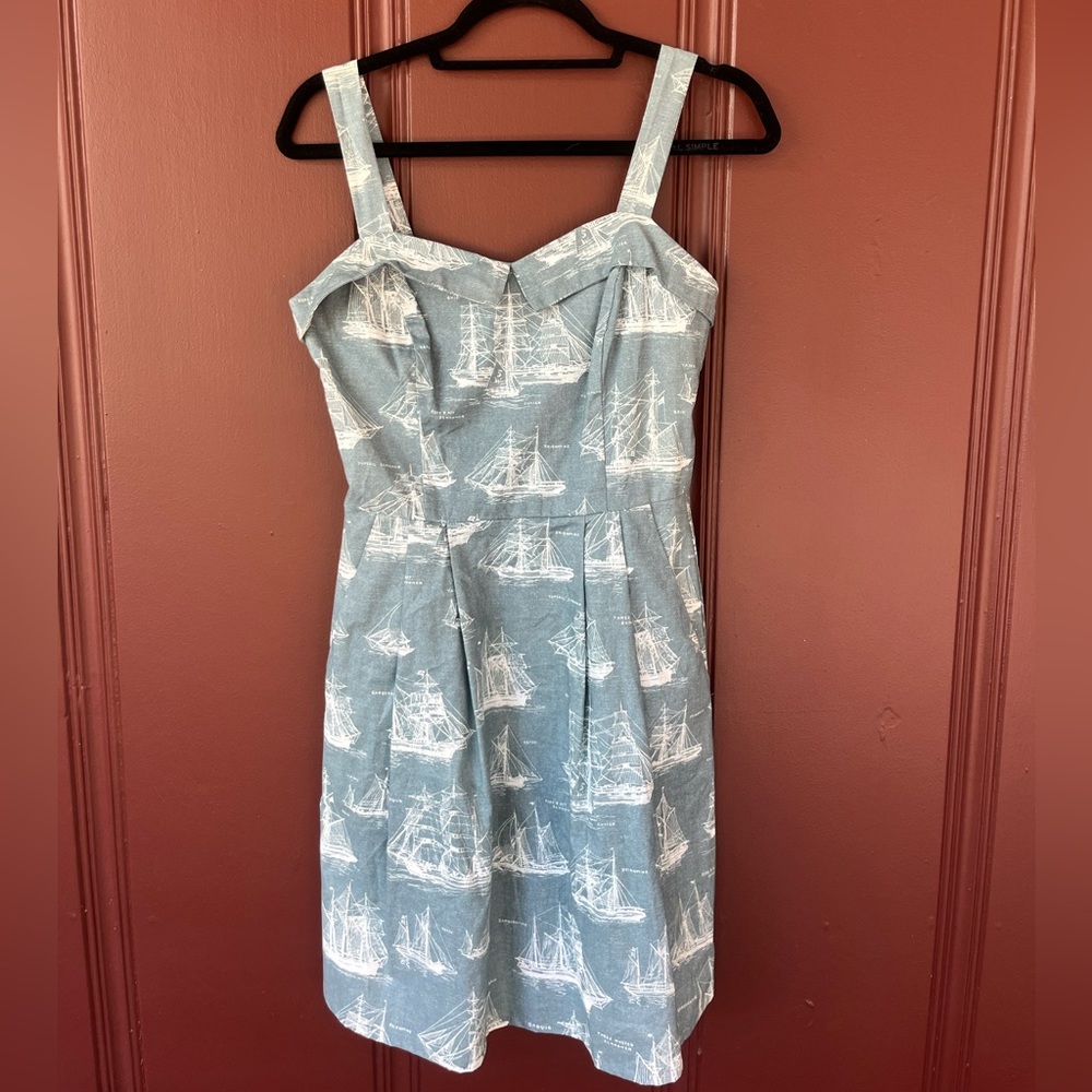 Unique 1950s inspired dress with sailboat print, collar detail, and pockets